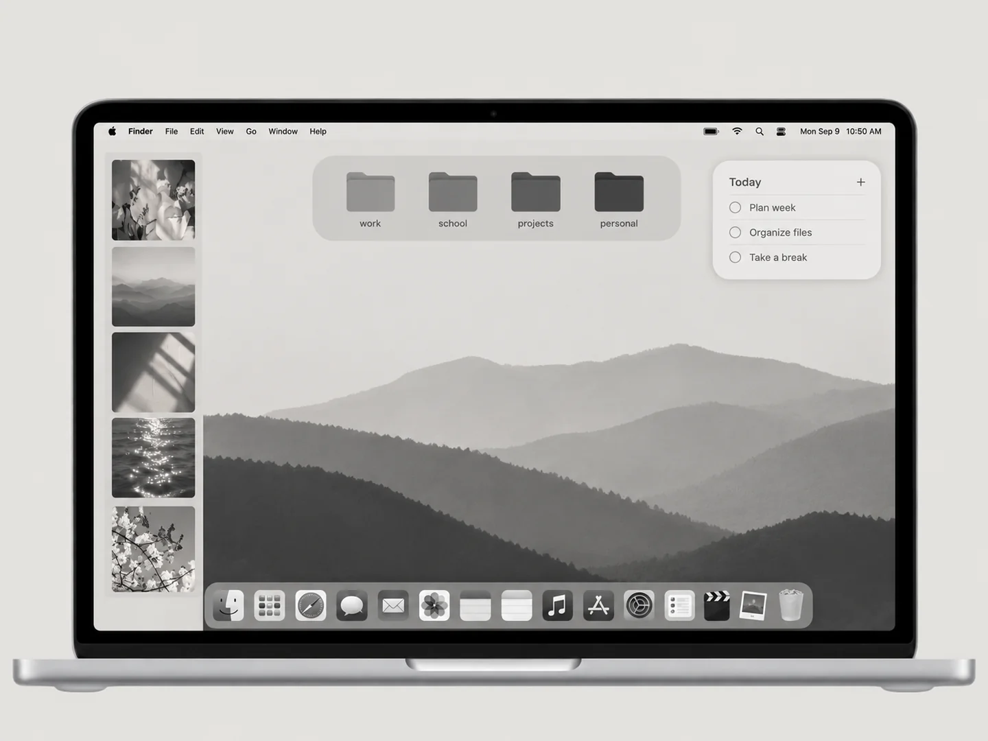 AI concept: charcoal minimal desktop with coordinated wallpaper and folder icons on a front-facing silver laptop.