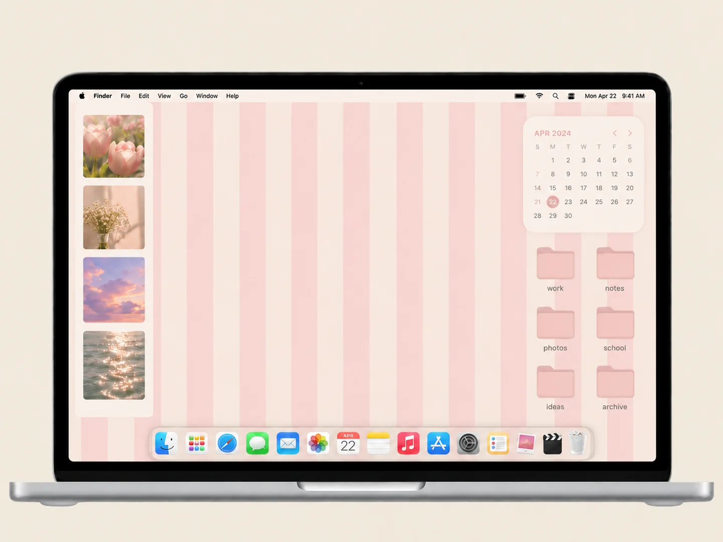 AI concept: pink stripes & coordinated folders with coordinated wallpaper and folder icons on a front-facing silver laptop.
